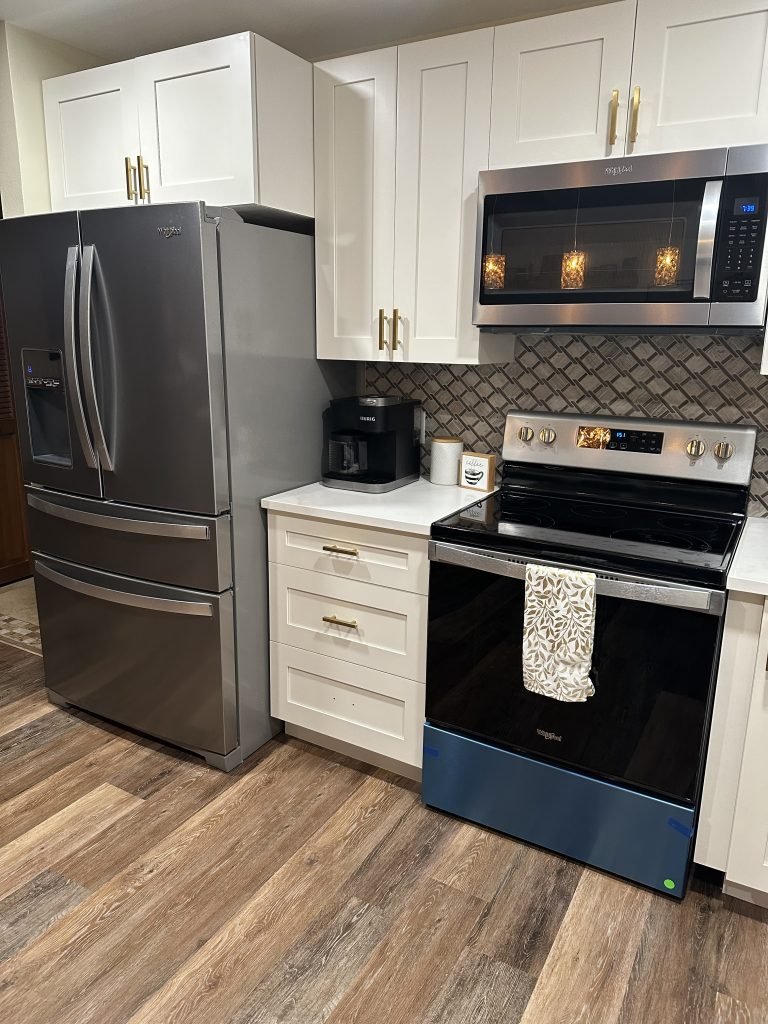 White Kitchen Cabinets and Stainless Steel Refrigator | Gallery Showcase